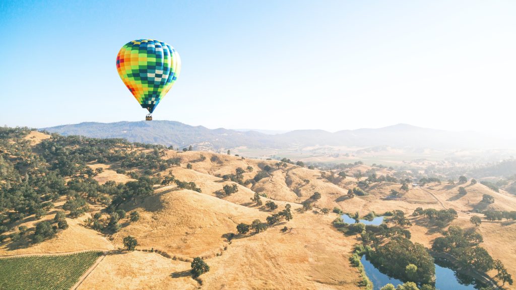 Hot air balloons floating over the Napa Valley in California. It doesn't look very budget friendly in this photo.